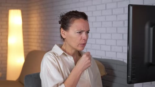 Woman Coughing with Sore Throat at Home