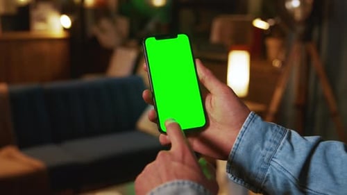 Hands Using Typing on Mobile Phone with a Vertical Green Screen Social Media Smartphone Mock Up