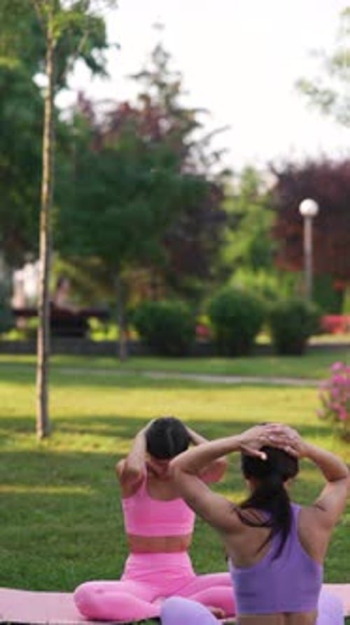 In the Summer Park a Sporty Mother and Her Daughter are Taking Part in Sports