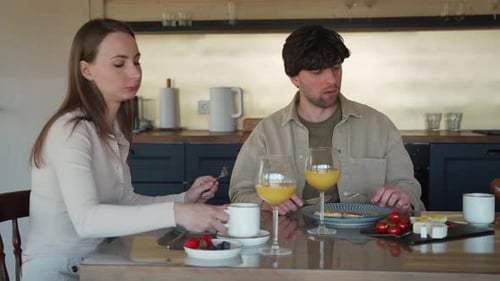 Couple Eating Breakfast Together at Home