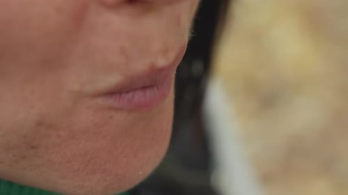 Closeup of Serene Woman Lips in Chilly Outdoor Setting Intimate Shot Capturing Woman with Chapped
