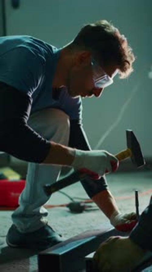 Focused Craftsman Engages in Precision Metalworking Demonstrating Skillful Techniques in a Workshop