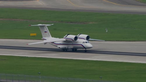White Aircraft Taxiing on the Runway