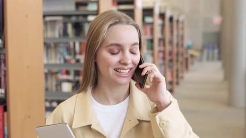 Happy Teenage Girl Student Talking on Phone Making Call Walking in College