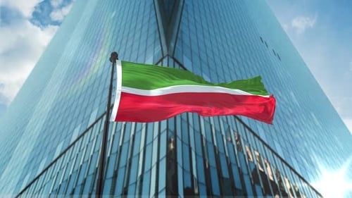 Waving Flag Animation in Front of Corporate Skyscraper