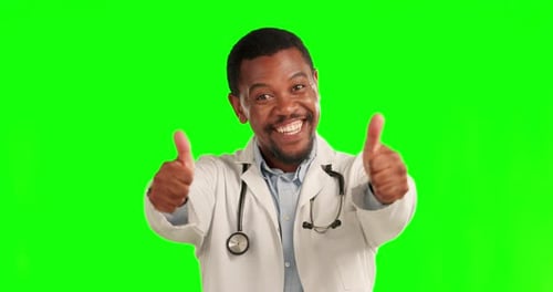 Thank you, doctor with thumbs up and against a green screen for healthcare