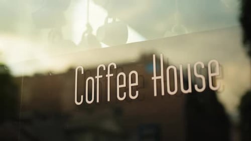 Glass Window of Coffee House in City Reflections and Urban Ambiance