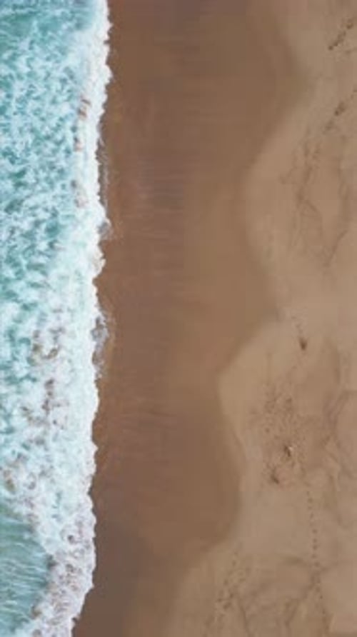 Grey Sea Water Covering Beach Vertically Aerial Top View Ocean Waves Foaming