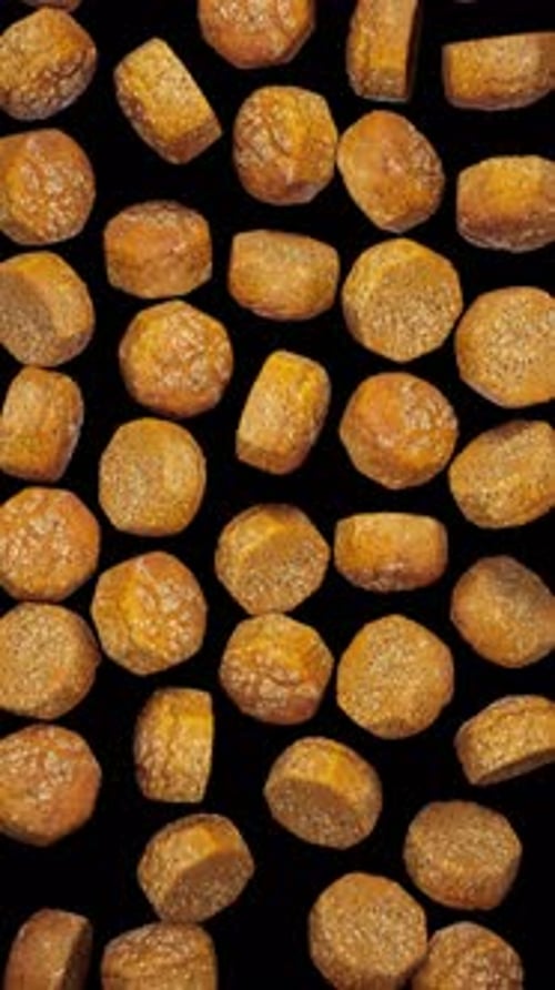 Looping Animation of Falling Meatballs on Transparent Background