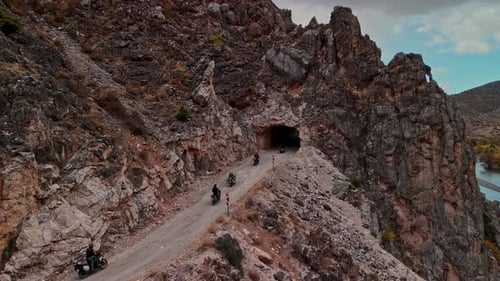 Motorcycle Convoy Entering Tunnel in Karanlik Canyon, Kemaliye, Turkey