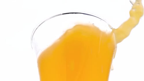 Juice Being Poured Into a Glass
