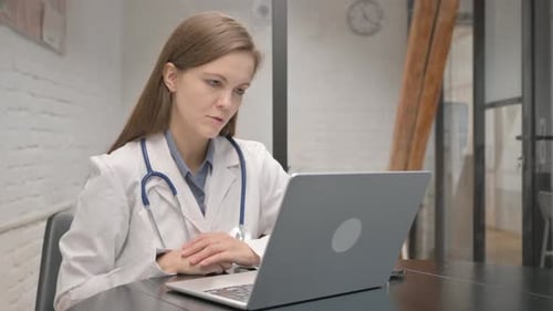 Doctor On Telehealth Call in Modern Office