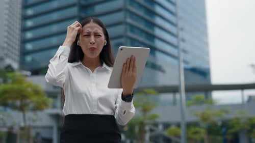 Frustrated Woman Having a Video Call Outdoors