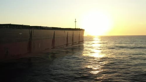 4K(24fps) Fly into panamax size bulk carrier vessel.