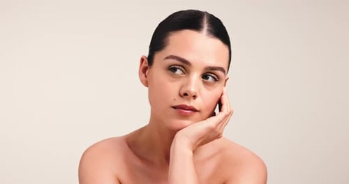 Face, beauty and skincare with woman in studio for thinking, confidence and skin wellness