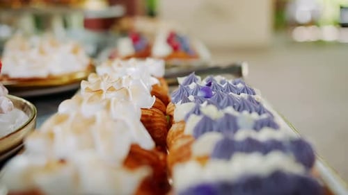 Pastries with cream, dessert table display close up