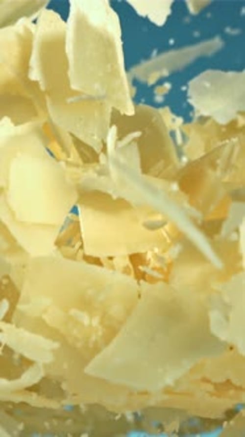 Parmesan Cheese Flies Up and Falls Down Filmed on a Highspeed Camera at 1000 Fps