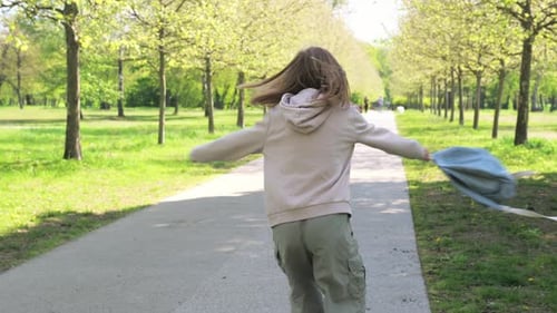 Joyful Little Girl Playing With Her Backpack After Finish School Lessons