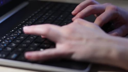 Hands Typing on Computer Keyboard Close Up