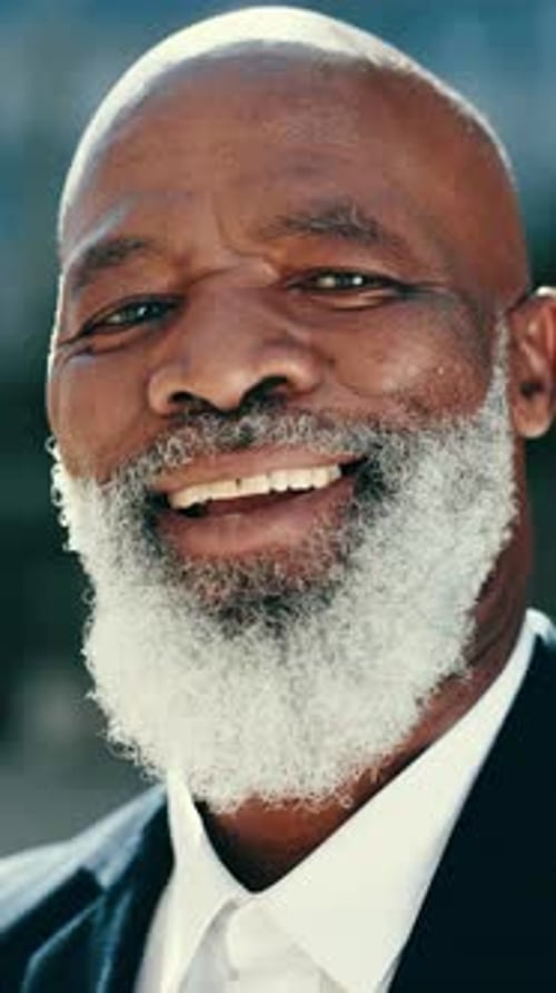 Happy, face and African businessman in the city with a confident, good and positive attitude