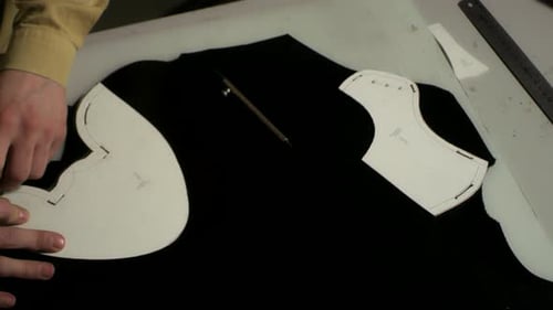 Leather craftsman hands working with tools in a leather workshop atelier