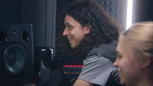 Sound Engineers Working in Music Recording Studio