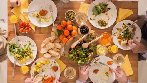 Family Meal Overhead View with Plates and Salad