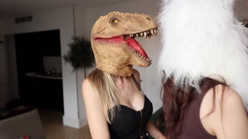 Friends Dancing in Animal Masks at a Costume Party