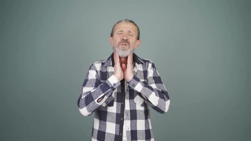 Adult Man Massaging Sore Throat