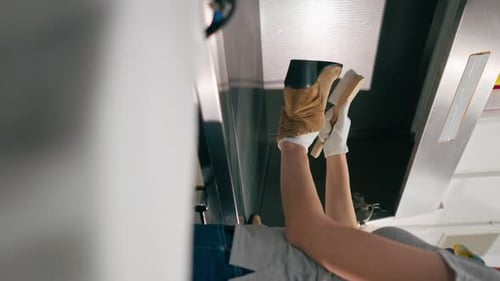 Vertical Video Close Up Professional Dry Cleaning a Young Girl Removes a Stain From Her Shoes the