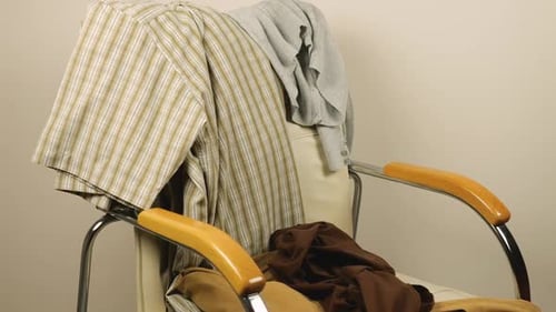 Clothes Thrown Onto Empty Chair