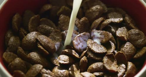 Chocolate Cereal Milk Pour in Dark Close-up