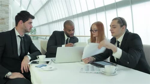 Business Colleagues Meeting in a Bright Office