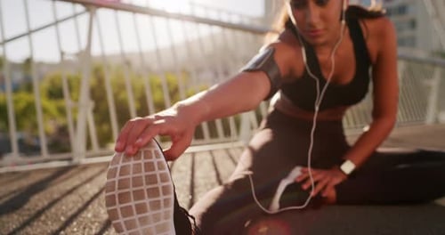 Woman Stretching on a Bridge in the City