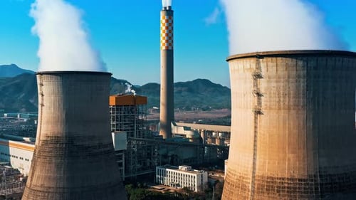 erial view of chimneys of power plant, an industrial district. Modern large thermal power plant