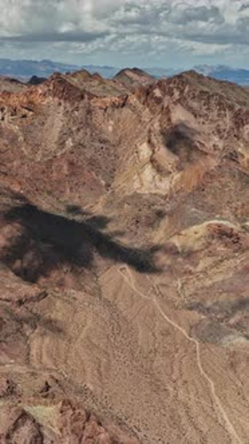 Stunning aerial view of rugged mountains in Nevada with dramatic shadows