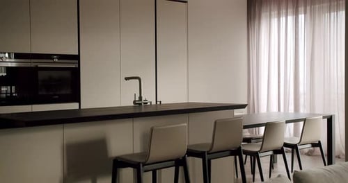 Modern Minimalist Kitchen and Dining Area in Neutral Tones