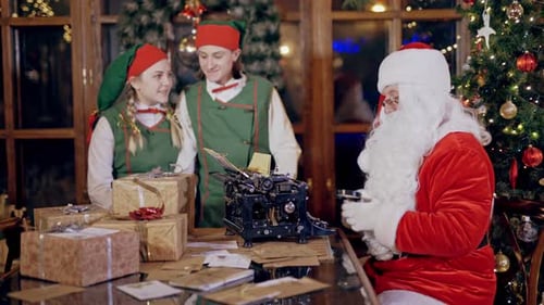 Santa Claus and Elves Preparing Gifts at Home