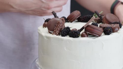 Decorating Cake with Chocolate and Berries