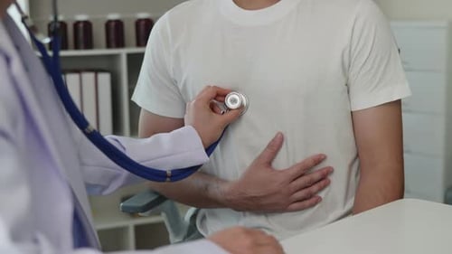 Doctor examining patient by listening lungs and breathing for Acute Respiratory Illness Clinic