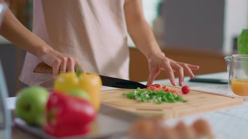 Woman Prepares Healthy Food in Bright Home Kitchen