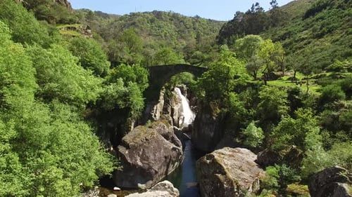 Historic Bridge and Waterfall in the Forest.