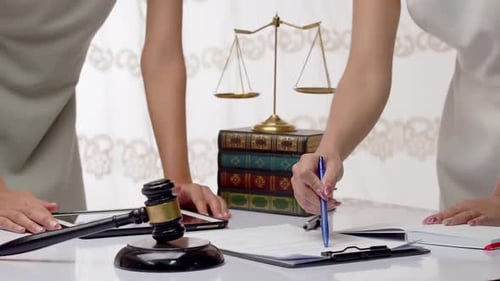 Lawyers research a legal issue - Concept: law, justice, deal, analysis, information, research, balan