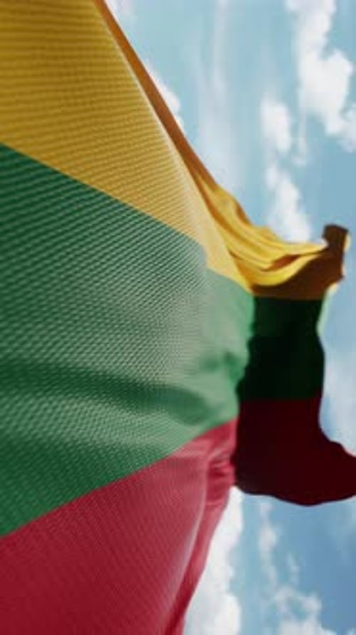 Realistic Lithuania Flag Waving with Blue Sky Background