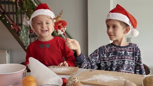 Children in Santa Hats Bake Christmas Cookies