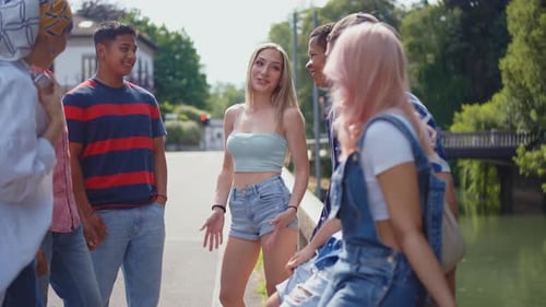 Diverse Young Adults Talking on a Sunny Day