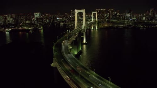 Aerial view of Tokyo Japan and rainbow bridge at night from helicopter