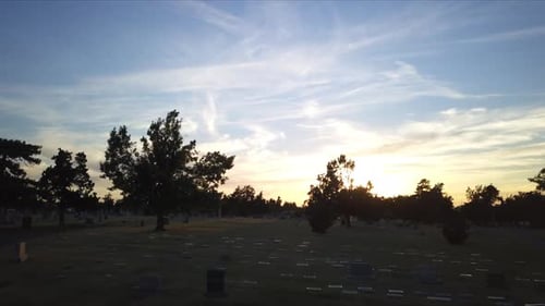 Ascending shot above a cemetery at sunset in Georgia, America