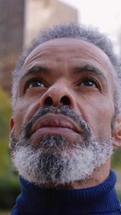 Portrait of Middle Age Latin American Man Standing Outside at Urban City Area