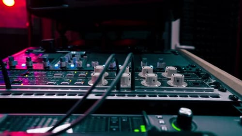 Close Up the Recording Room is Dark with Neon Lighting Prorecording Remote Control for Adjusting and